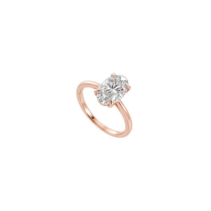 Rose gold ring with a diamond on a white background